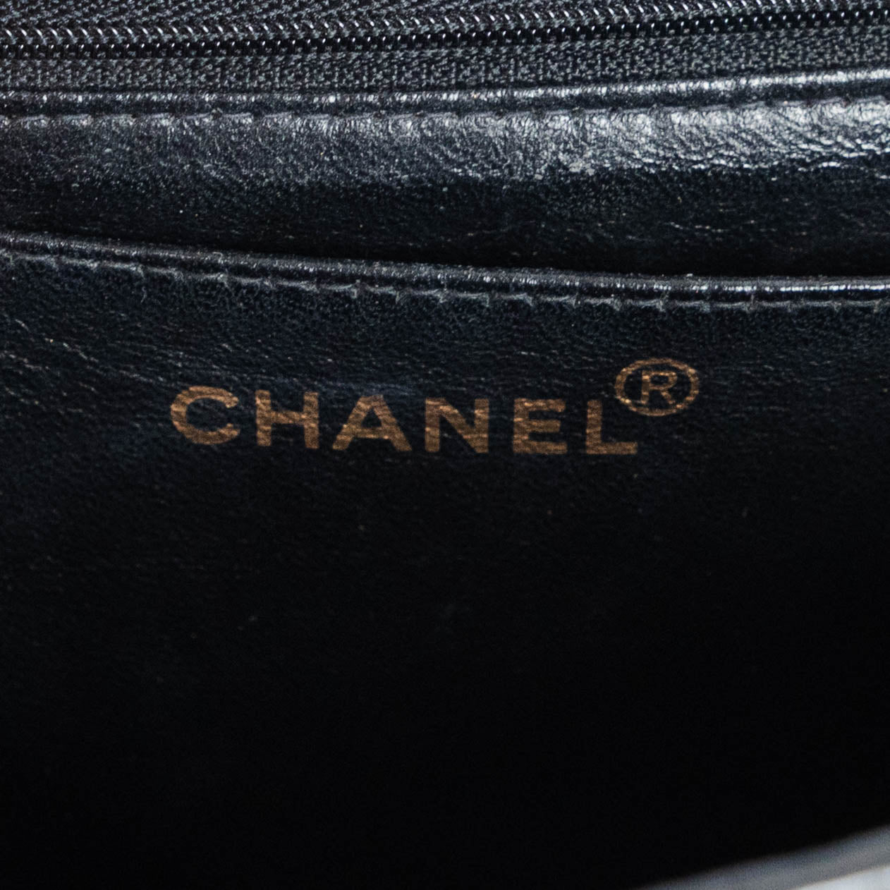 CHANEL quilted flap handle bag