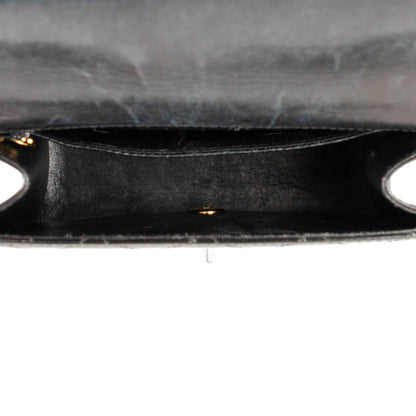 CHANEL quilted flap handle bag