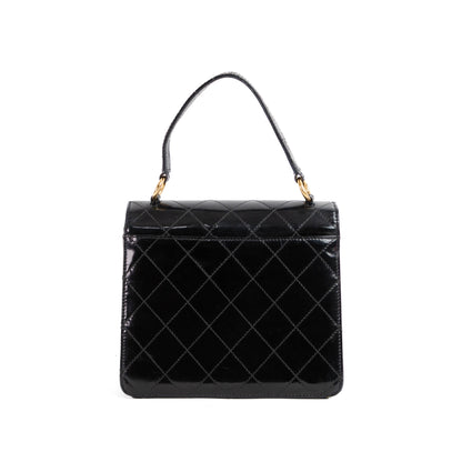 CHANEL quilted flap handle bag