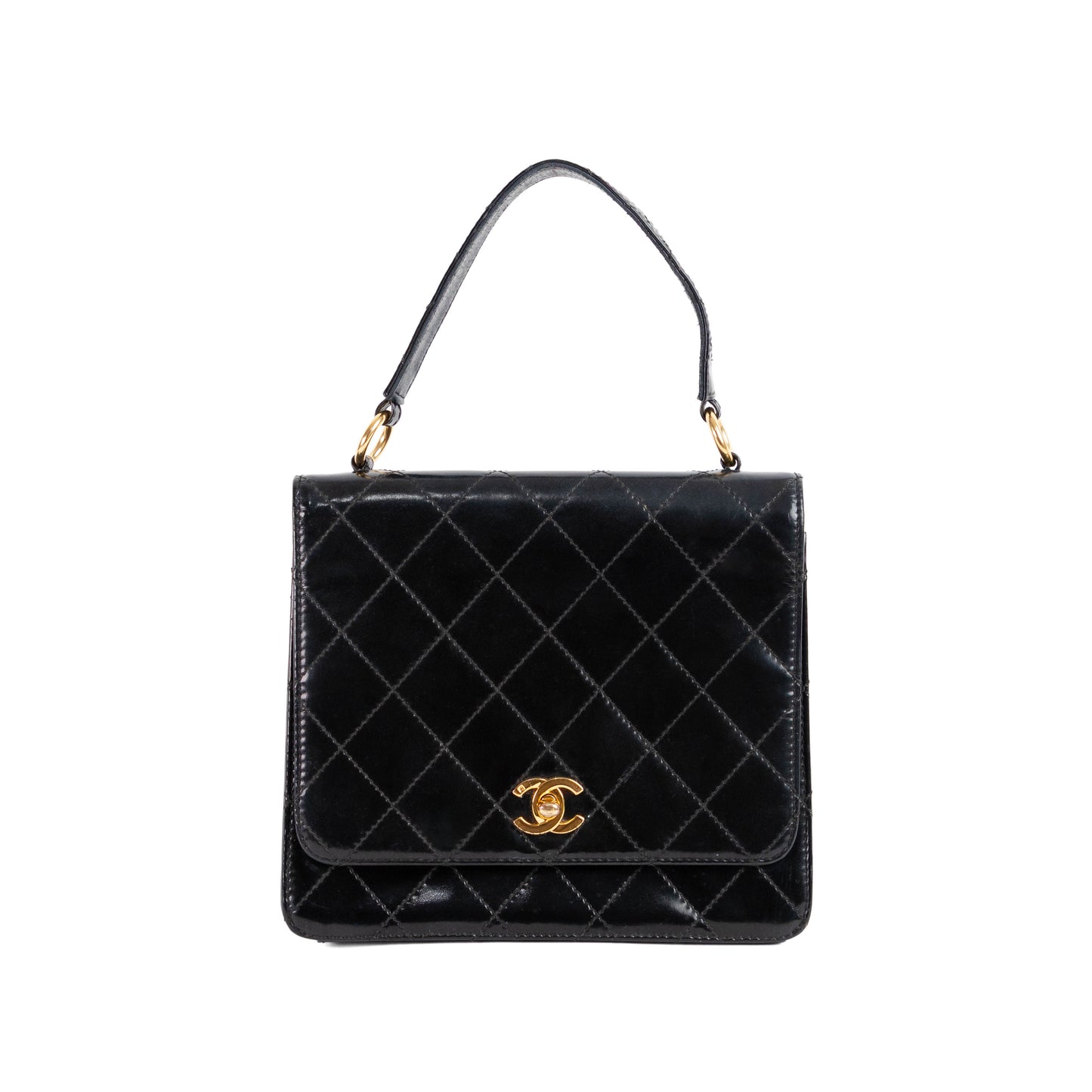 CHANEL quilted flap handle bag